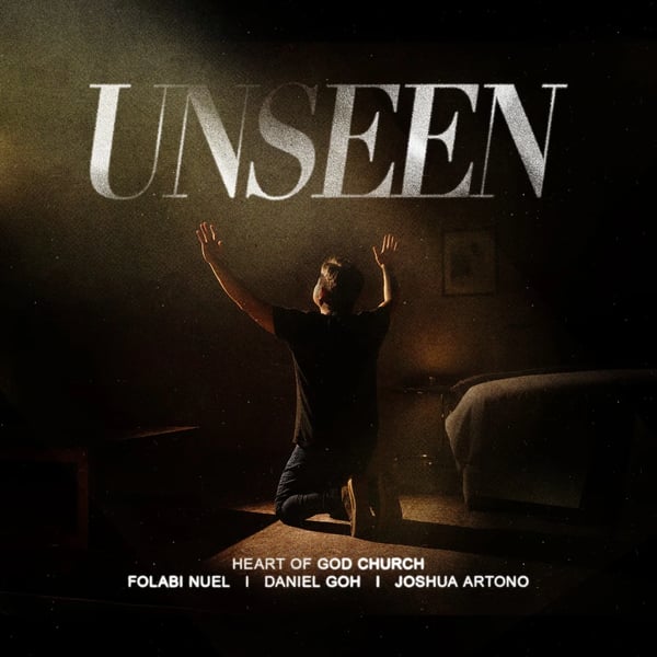 Unseen by Heart of God Church, Folabi Nuel, Daniel Goh and Joshua Artono official song cover - a man kneeling with hands raised in a dark room